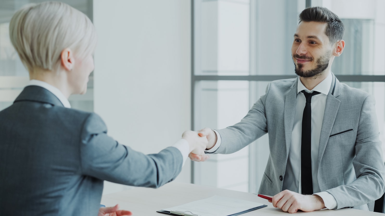 Business partnership handshake